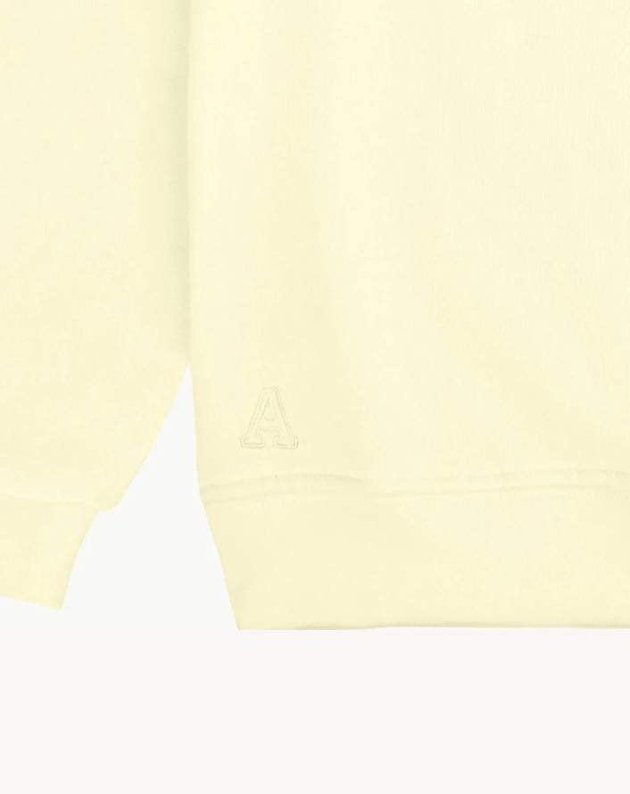 detalle_logo_sudadera_yellow_Anitials