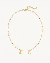 COLLAR BOLITAS CORAL ORO | INICIALES MINI