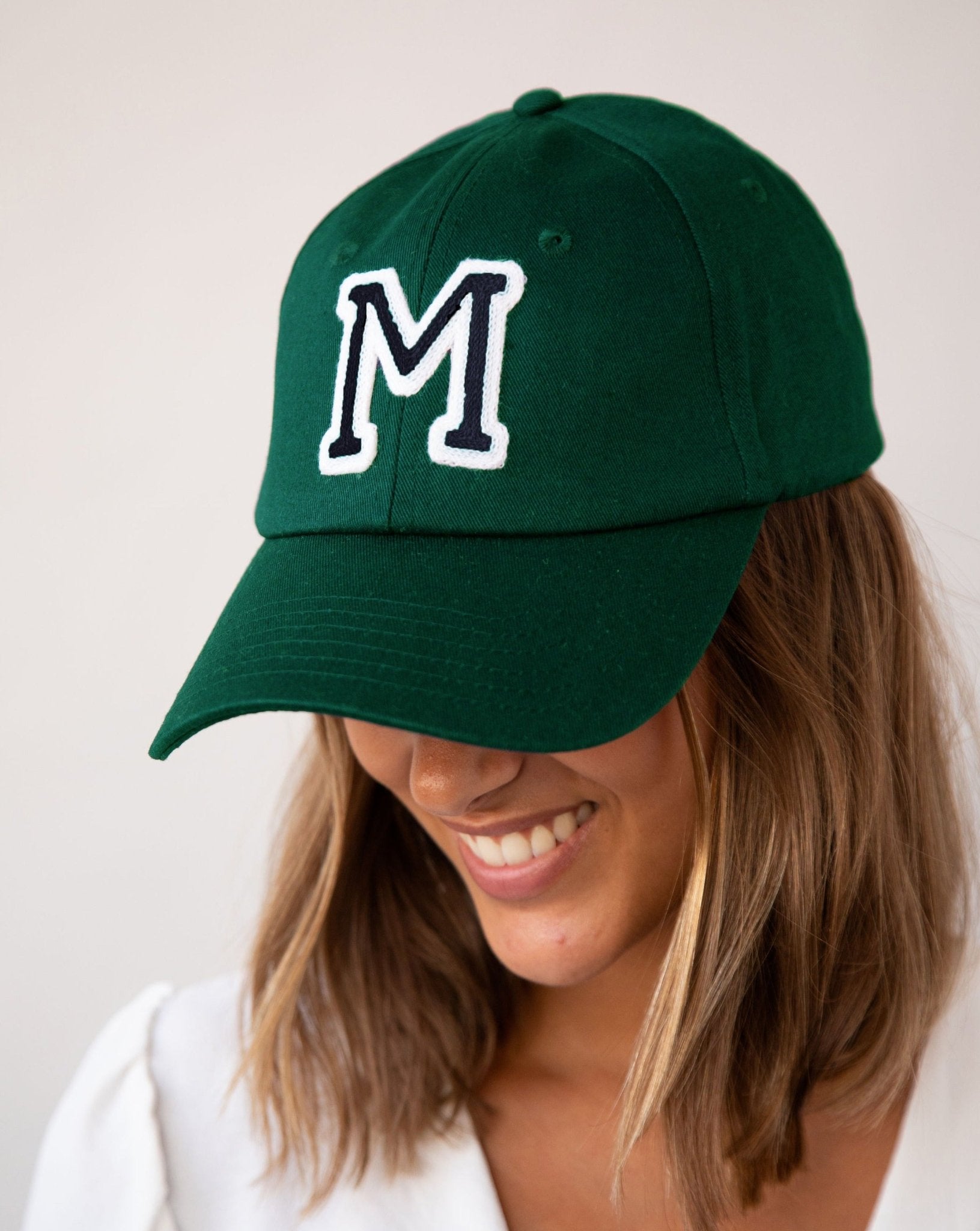 Dark green baseball cap on sale