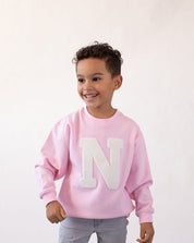 sudadera_light_pink_inicial_rizo_centro_Anitials_